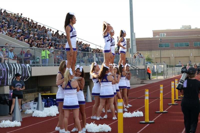 The Cheer team stacking up in pyramids. Photo by: Enrique Paz