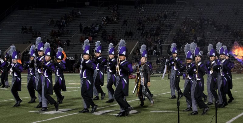 Players and Color Guard moving together in one of the yard lines. Photo by: Enrique Paz
