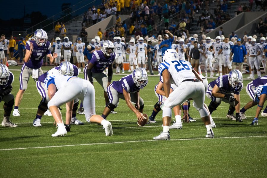 Quarterback Luke Pardee prepares to receive the snap. Photo by: Piotr Fraczek