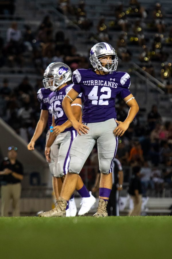 A football player stares into the distance. Photo by: Tyler Grosvenor