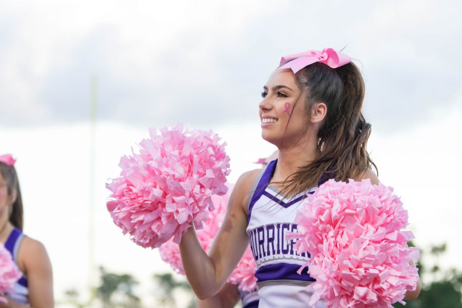 A cheerleader hyping everyone up one afternoon at a football game. Photo by: Charlotte Gottfried