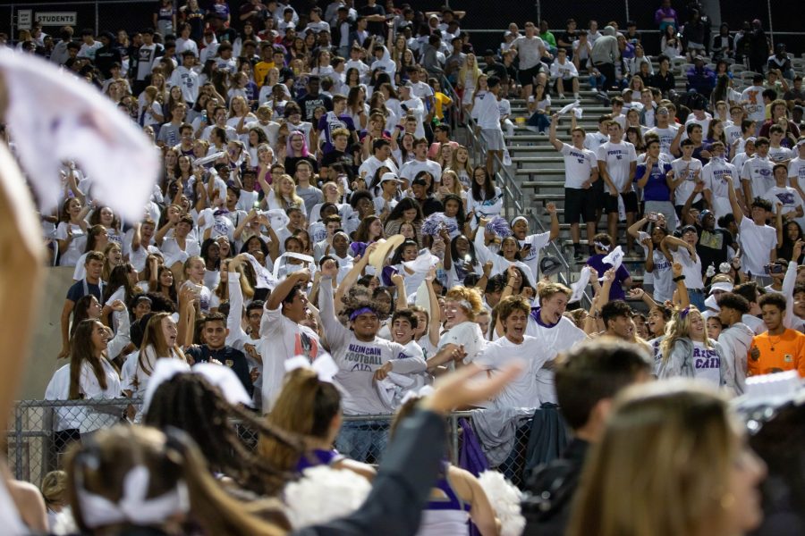 Students participate in "White Out" night as they help the Caniacs and Cheer rally the team. Photo by Charlotte Gottfried.