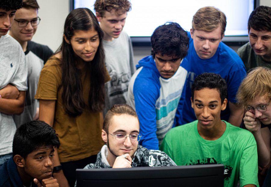 Group of hack club students collaborating on an HTML5 website on repl.it.