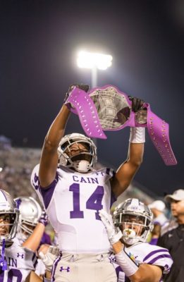 Isaiah Elmore celebrating after receiving the turnover belt after forcing a turnover. Photo by: Tyler Grosvenor