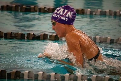 Charlotte Gottfried rapidly swimming at one of her meets against Klein Collins. Photo by; Enrique Paz