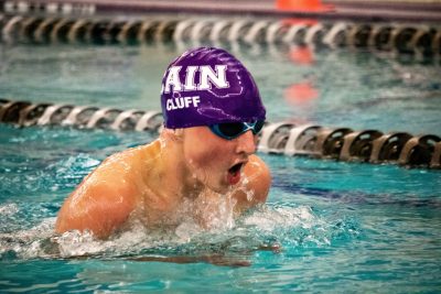 Dylan Cluff swimming against a Klein Collins opponent on one of his varsity meets. Photo by: Enrique Paz