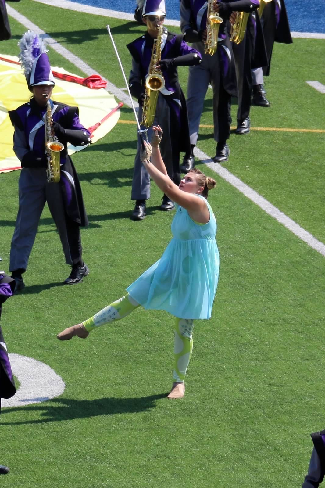 Baylie Sutton tossing a saber while performing during the Lone Star Preview. Photo by Kim Yearout