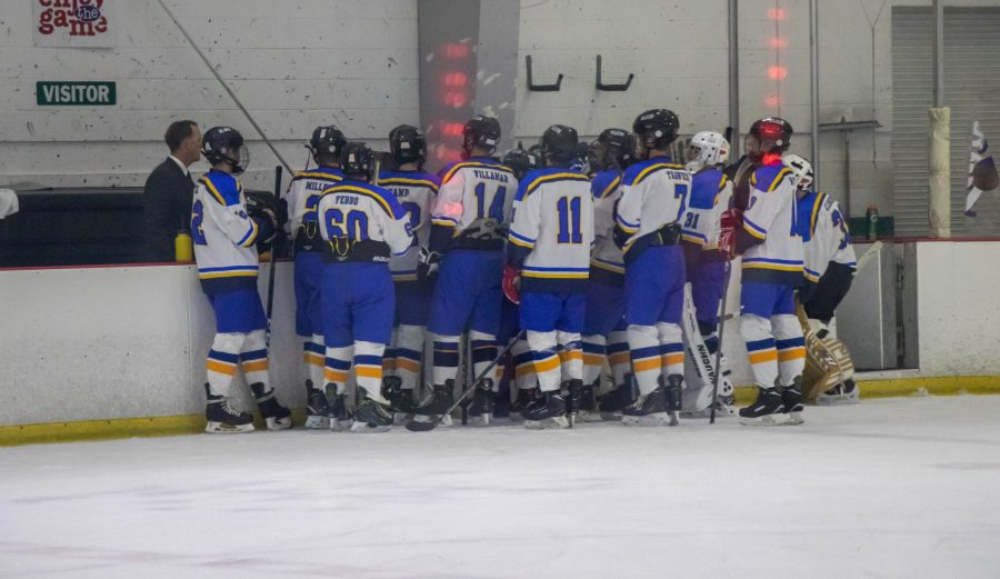 Klein Cain Hockey team huddling up during a timeout. Photo by: Nathan DeSimone
