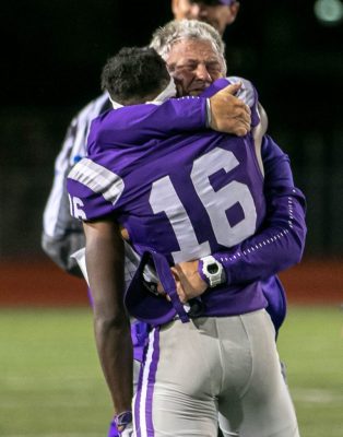 Coach Poth and Reginald Fain embracing each other after a win against Klein Oak and qualifying for playoffs. Photo by: Zoe Rivers