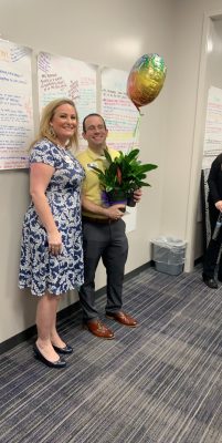 Assistant Principle Chase Debord accepting his teacher of the year award from Klein Cain Principle Nicole Patin