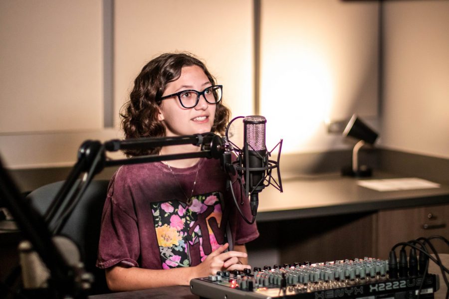 Gracie Solomon interviewing for her podcast in the sound booth. photo by: Zoe Rivers