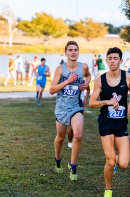 Varsity cross country runner at Klein Cain, Drake Wells, pushing through the race at the Texas 6a UIL state meet. Photo by: Charlotte Gottfried 