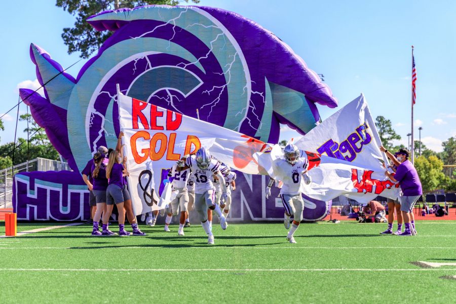 Klein Cain football team running out to the field in hopes of winning the game. Photo by: Charlotte Gottfried